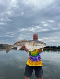 Redfish casting peace in salty air