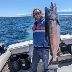 Angler catching a fish in Sooke