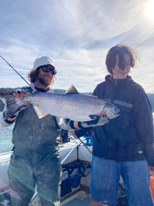 A group of 3 people fishing in the beautiful location of Sooke