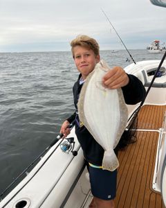 A lone angler fishing in the waters of Point Pleasant