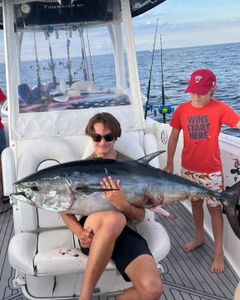 3 people fishing for a big fish in NJ