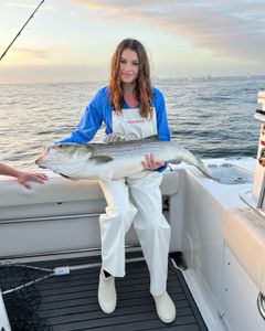 A person fishing with rod in New Jersey