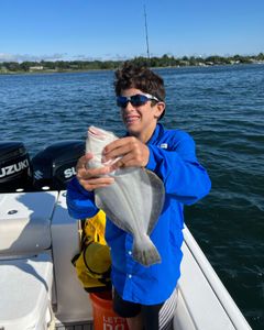 Angler catches a small freshwater fish in New Jersey