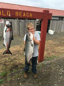 Two coho salmon and sea trout fish caught in OR