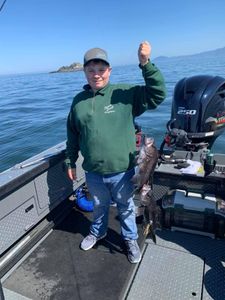 Two fishing rods with a person catching fish in North Bend
