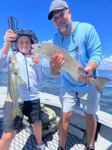 Strong redfish and snook double—perfect day on the water.