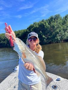Angler holding a 25-inch fish in Riverview