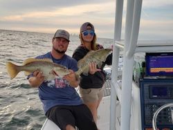 Two anglers fishing in Florida with 2 big fish
