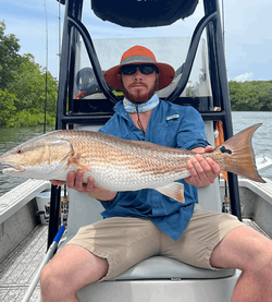 Angler with a large 31-inch Redfish caught in Riverview