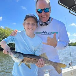 Snook fish caught in FL by two people fishing