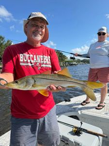Snook fish caught by two people in Riverview