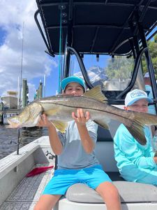 Snook fish caught by two people in Riverview