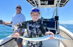 Two people enjoying a cruising and fishing adventure in NC