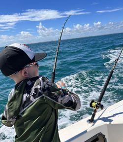 A person enjoying a fishing cruise at Wrightsville Beach