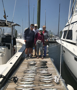 Four people enjoying a cruise and fishing trip in NC