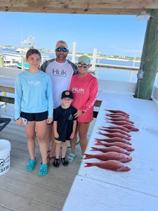 4 people fishing at Orange Beach
