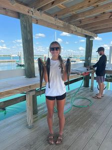 Two people fishing in Orange Beach
