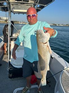 Angler with rod fishing at Orange Beach