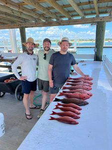 Three people enjoying a fishing trip in AL