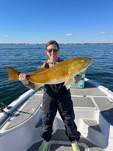 An angler enjoying a fishing trip in Orange Beach