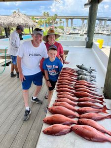 3 people enjoying a great fishing trip in Orange Beach