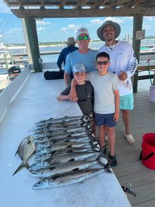 Fresh caught Spanish mackerel displayed on fishing boat deck in Orange Beach Alabama