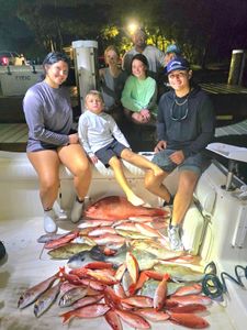 Seven people enjoying cruises and fishing in the beautiful Gulf Breeze location.