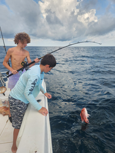 A person fishing in Gulf Breeze