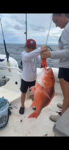 Two people enjoy a fishing cruise in Gulf Breeze