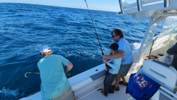 Two people enjoying a cruises and fishing adventure in Gulf Breeze