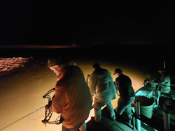 A person fishing in the waters of Del Rio