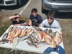 Two fishermen in FL with 2 nice fish