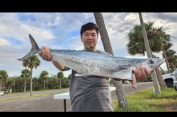 Catching a king mackerel fish while fishing in FL
