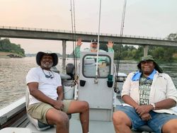 Three people fishing in Corning