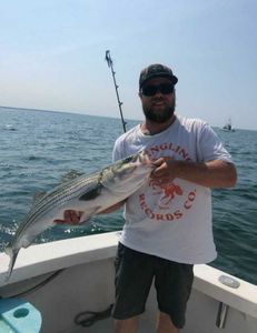 Lone angler fishing in the waters of Cape Cod