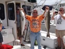 Two striped bass caught by three people in MA