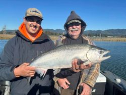Big smiles and a gleaming Chinook Salmon!