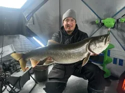 Angler with a 36-inch fish in MB