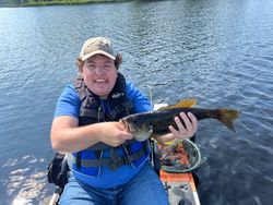 A single angler fishing in Saranac Lake