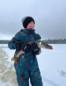 Angler fishing with rod and reel in Saranac Lake