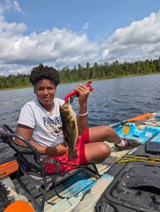Angler catching a fish in Saranac Lake