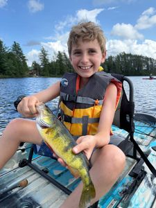A lone angler fishing in Saranac Lake