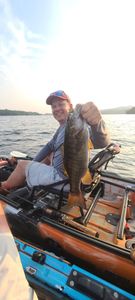 A person fishing in Saranac Lake