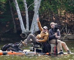 Two people enjoying a fishing trip in NY