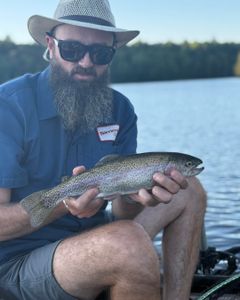 Angler catching a rainbow trout in New York