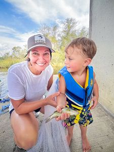 Fishing adventure in Bagdad FL with young angler by concrete structure