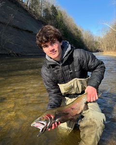 Man fishing on Pittsburgh riverbank