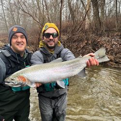 Angler with rainbow trout fish in Pittsburgh