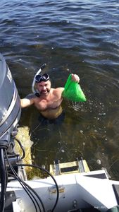 Snorkeling activity in Brooksville FL waters with collection bag