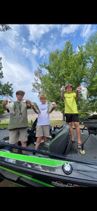 Three people fishing in the Mississippi river